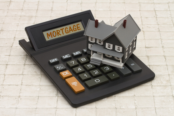 Home Mortgage, szürke ház és kő háttér kalkulátor - Fotó, kép