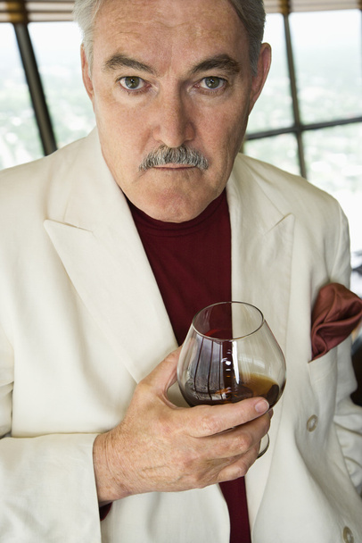Man holding drink. - Zdjęcie, obraz