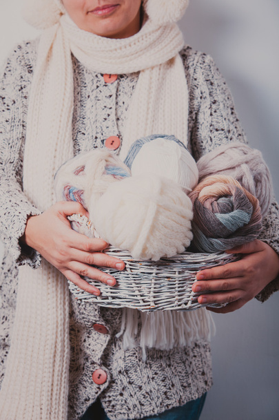 Woman with basket of balls woolen yarn - Фото, зображення
