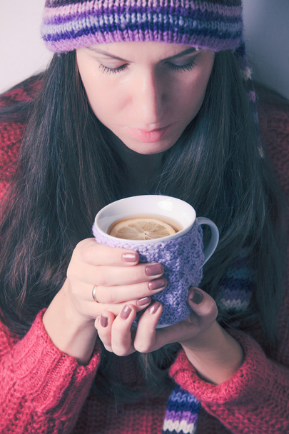 Woman with cup of tea - Фото, изображение