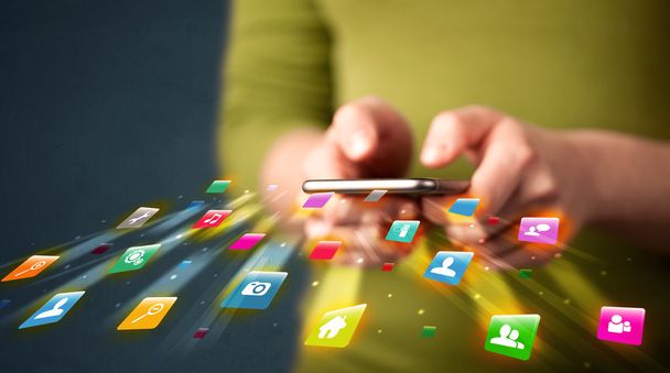 Man holding smartphone with technology application icons - Photo, Image