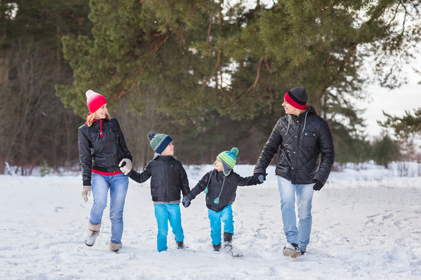 Happy family in the winter forest. - Fotografie, Obrázek