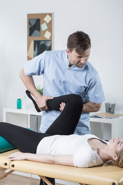 Exercises with physiotherapist - Foto, afbeelding