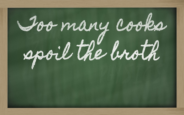 Expression - too many cooks spoil the broth - written on a scho - Photo, Image