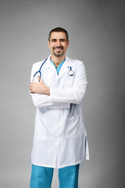 doctor on grey background - Fotografie, Obrázek