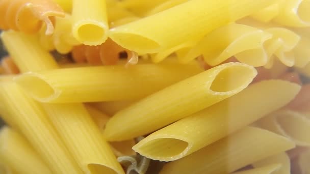 Rotated uncooked Italian macaroni pasta. - Footage, Video