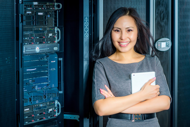 Engineer businesswoman in network server room - Photo, Image