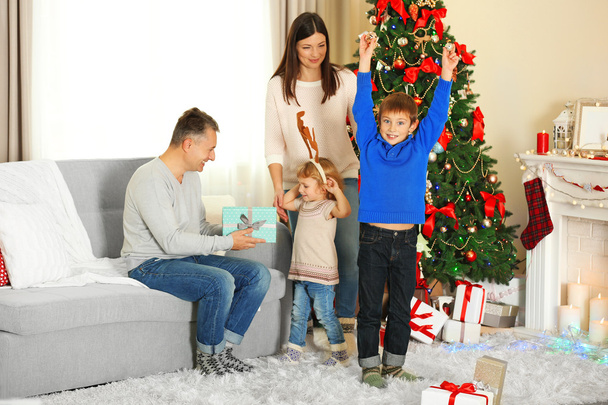 Happy family with gift boxes  - Valokuva, kuva