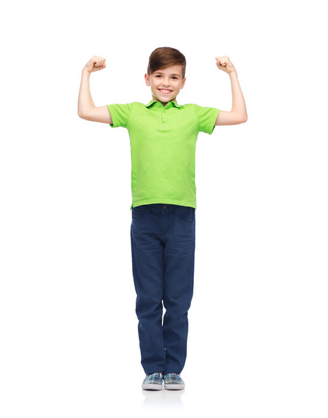 happy boy in polo t-shirt showing strong fists - Valokuva, kuva