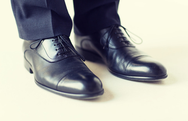 close up of man legs in elegant shoes with laces - Foto, immagini