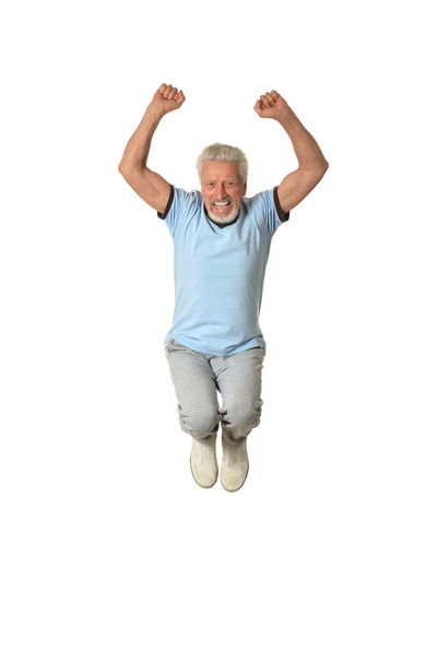 Senior man jumping - Фото, изображение