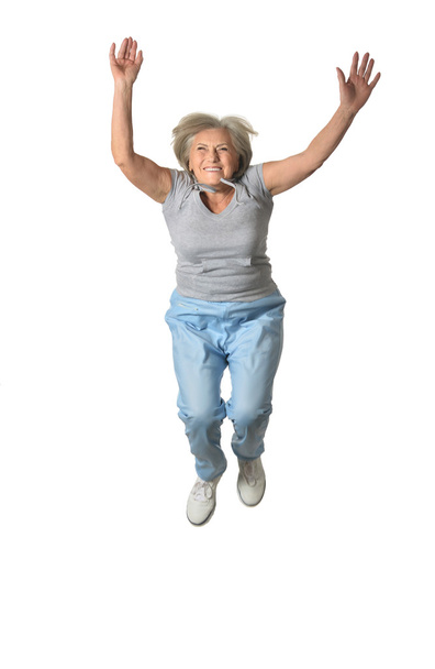 Senior woman jumping - 写真・画像