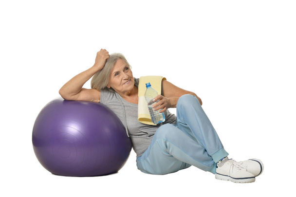Senior womanr with water after exercising - Photo, Image