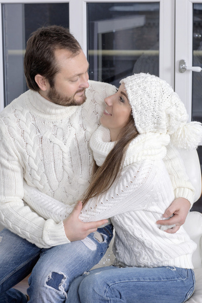 Portrait of husband and wife in white sweaters. - Photo, Image