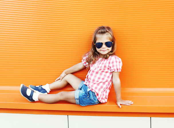 Fashion little girl child wearing a sunglasses and checkered shi - Photo, image