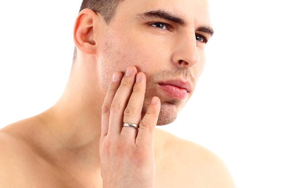 Close-up of young man applying shaving cream isolated - Фото, зображення