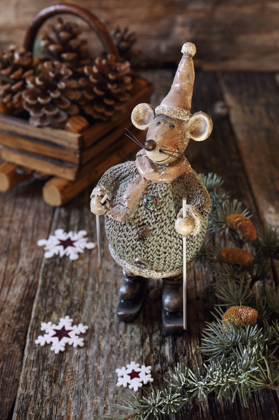 Christmas background: Mouse figurine on skis  - Photo, Image