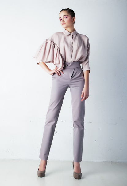 Stylish girl in casual clothes posing in studio - Valokuva, kuva