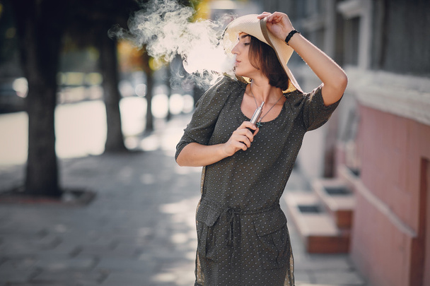 Girl with E-cigarette - 写真・画像