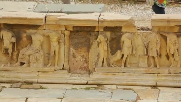 Ancient relief with antique mythological creatures at Theater of Dionysus ruins - Imágenes, Vídeo
