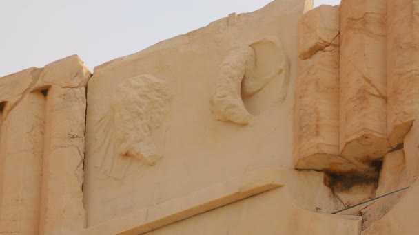 Classical Greek architecture detail, remains of stone relief on top of building - Filmati, video