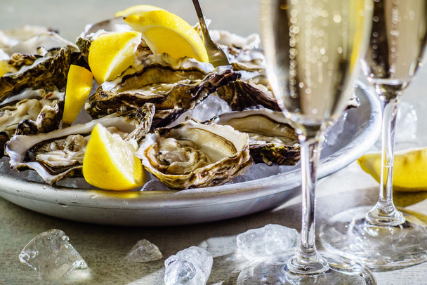Oysters  with lemon and champagne - Photo, Image