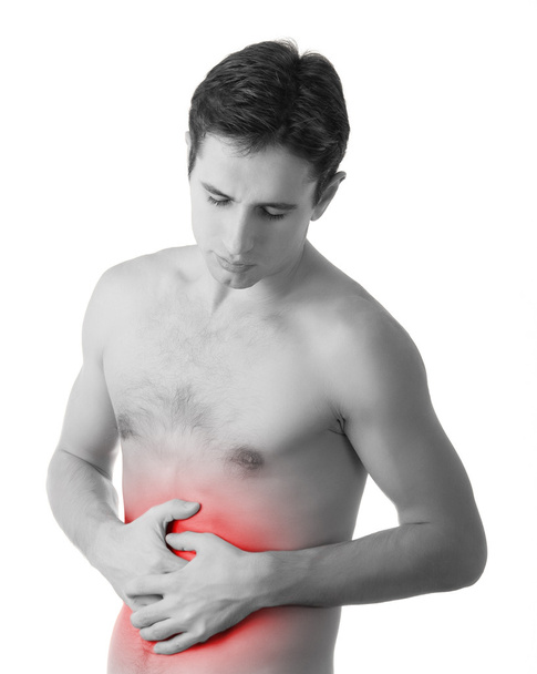νέος άνθρωπος που κρατά στο στομάχι του στον πόνο, που απομονώνονται σε λευκό ΒΑ - Φωτογραφία, εικόνα