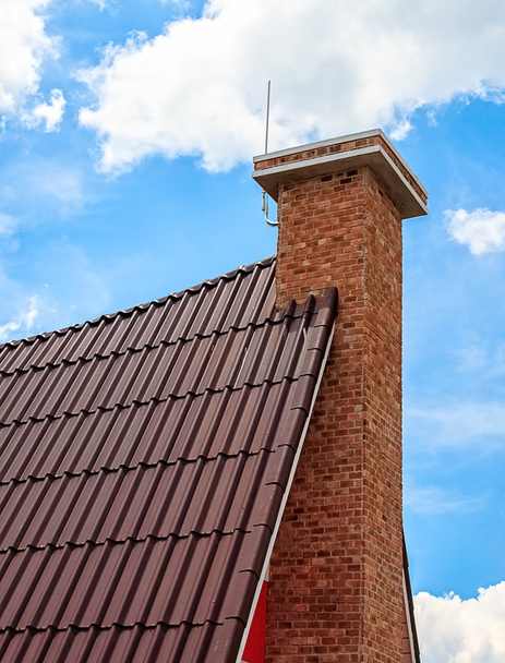 Chimney on the Tile Roof against Sky Background - Foto, imagen