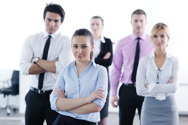 Business woman standing with her staff in background - Foto, Imagen