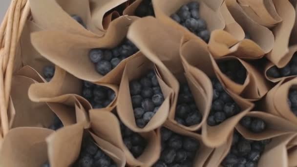 A brown paper bag full of picked blueberries - Felvétel, videó