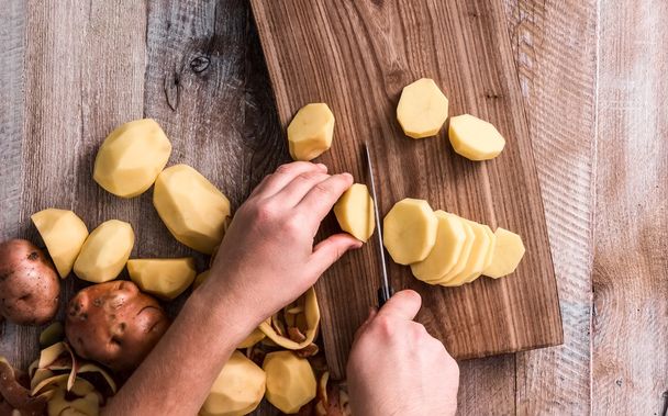 hands cutting potato - Photo, Image