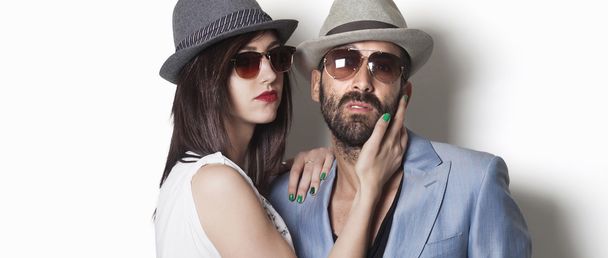 Gangster couple wearing hats and looking letterbox - 写真・画像