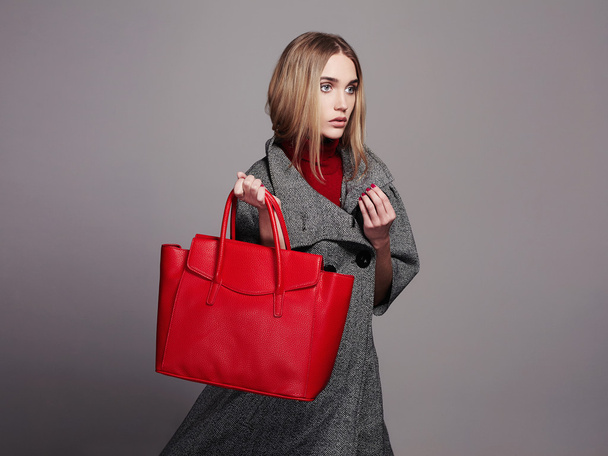 beautiful Woman with Handbag.Beauty Fashion Girl in topcoat.winter Shopping - Fotoğraf, Görsel