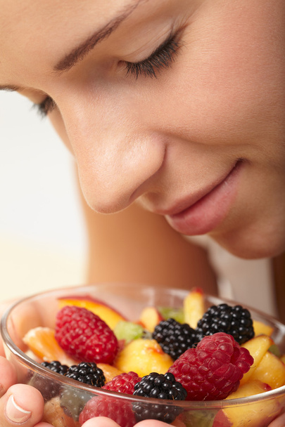 Woman eating fruit salad - Photo, image