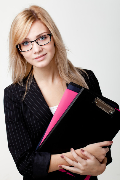 Businesswoman with a folder - Foto, imagen