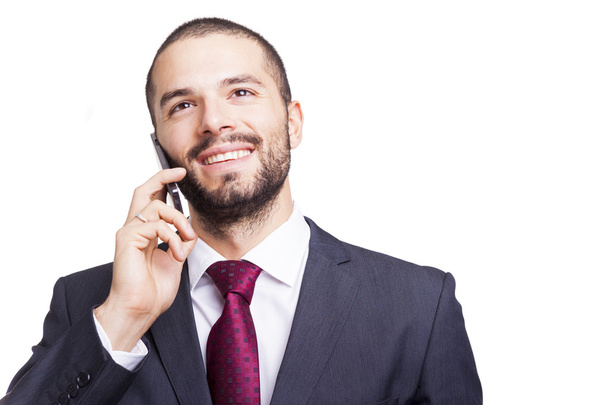 Portrait of a handsome businessman talking on the phone - Foto, afbeelding