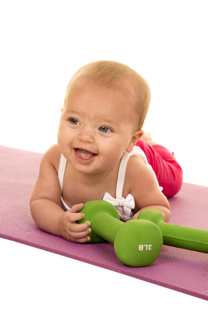 baby laying with fitness weights - Foto, Imagen