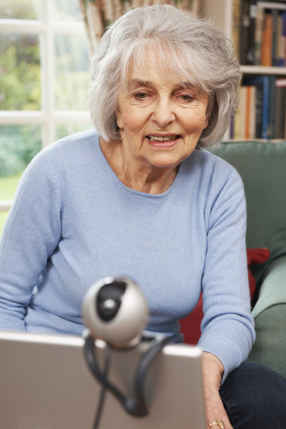 Senior Woman Using Webcam To Talk With Family - Фото, изображение