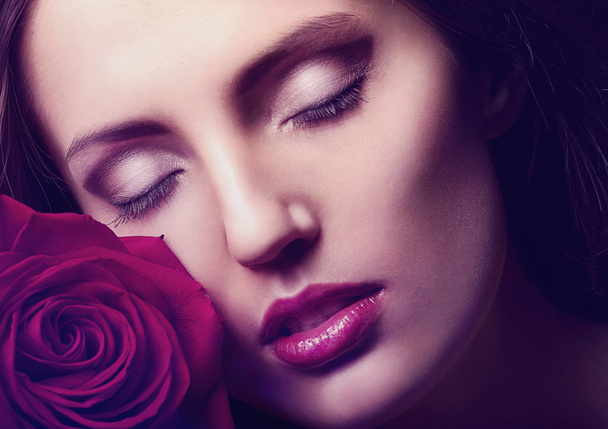 Portrait of a woman's face with rose - Foto, imagen