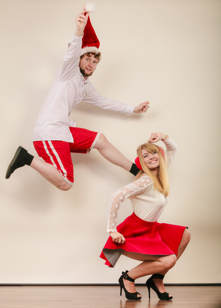 Happy active couple dancing and jumping. - 写真・画像
