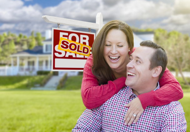 Couple In Front of Sold For Sale Sign and House - Photo, Image