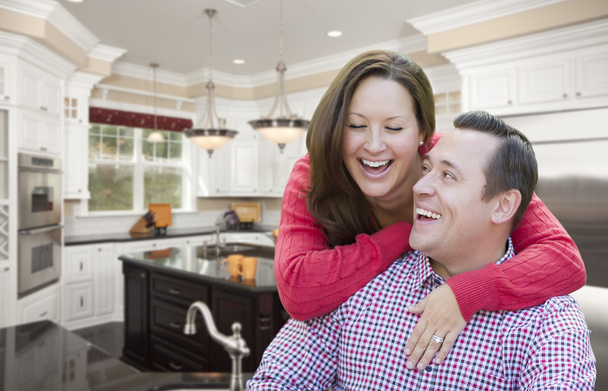 Happy Laughing Couple In Beautiful New Kitchen - Photo, Image
