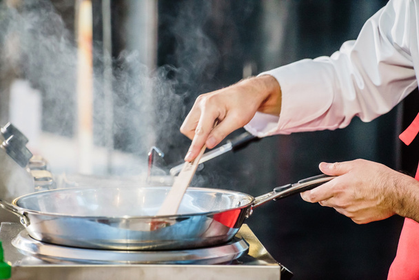 chef cooking  with pan - Фото, зображення