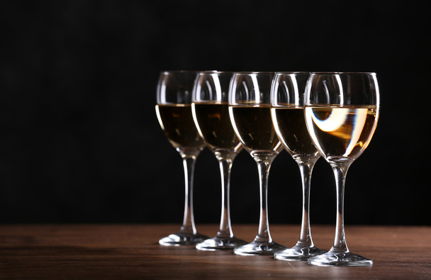 Half full wine glasses on a table - Zdjęcie, obraz