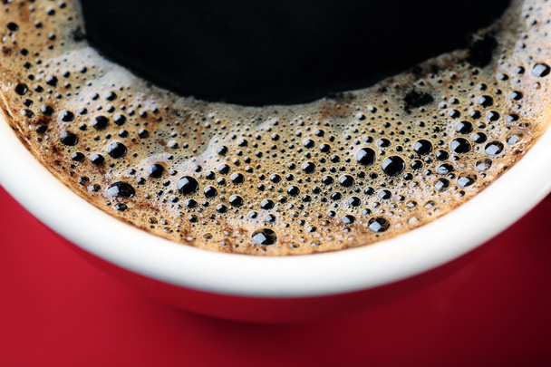 A red cup of tasty coffee, close-up - Photo, Image