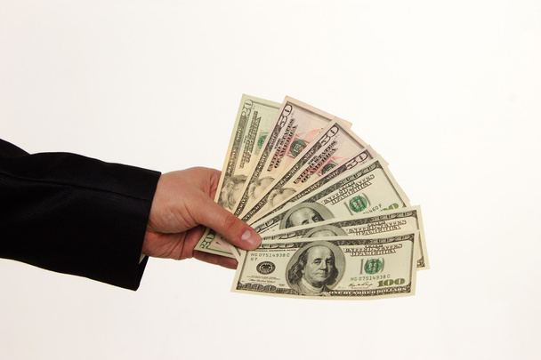 Hand handing over money isolated on white background - Φωτογραφία, εικόνα