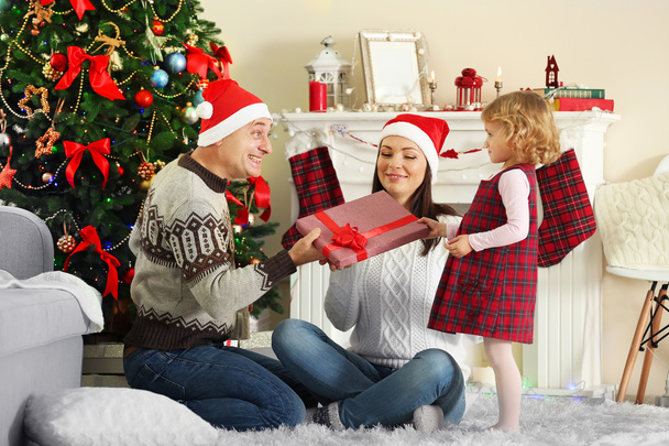 Happy Family at Christmas tree - Φωτογραφία, εικόνα