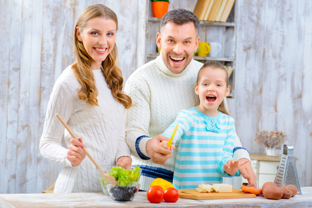 Happy family cooking together - 写真・画像