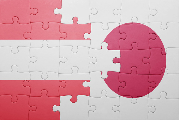 puzzle with the national flag of austria and japan - 写真・画像