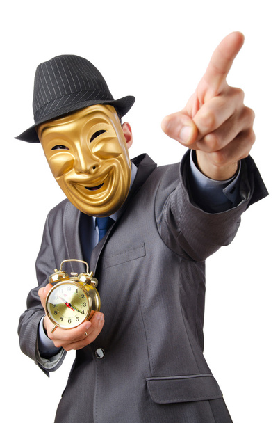 Maskierter Mann mit Uhr auf weißem Hintergrund - Foto, Bild